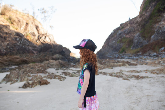 Young girl looking sideways at the beach