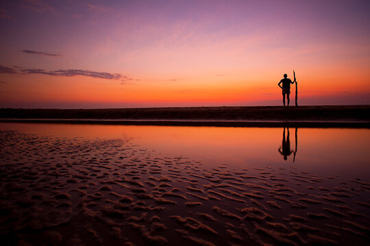Lone tribal silhouette at sunset