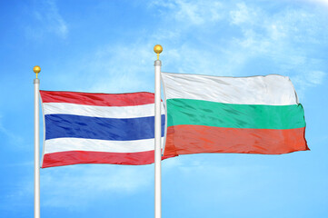 Thailand and Bulgaria two flags on flagpoles and blue sky