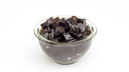 Black grass jelly on a white background.