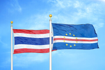 Thailand and Cape Cabo Verde two flags on flagpoles and blue sky