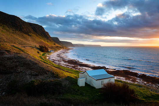 Coastal shack on water's edge