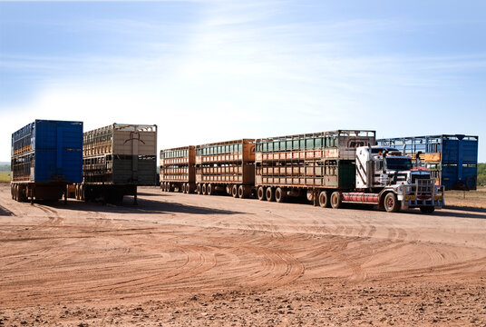 Lorries parked on dirt in outback