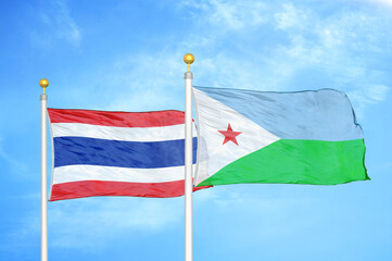 Thailand and Djibouti two flags on flagpoles and blue sky