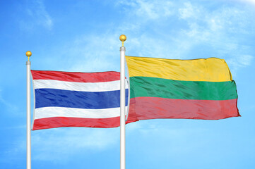 Thailand and Lithuania two flags on flagpoles and blue sky