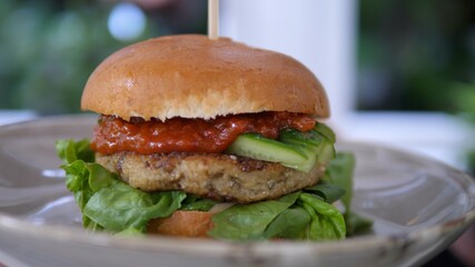 Vegan Burger on the plate. Fast food.