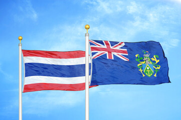 Thailand and Pitcairn Islands two flags on flagpoles and blue sky