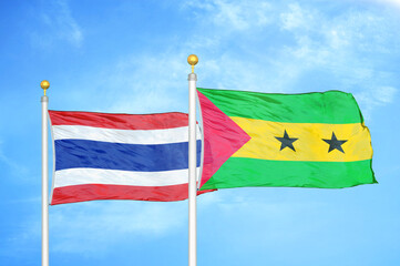 Thailand and Sao Tome and Principe two flags on flagpoles and blue sky