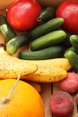 Seasonal fruits and vegetables in a wooden box 