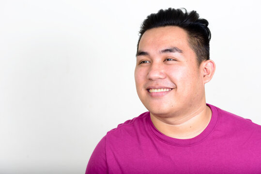 Portrait Of Happy Young Handsome Overweight Asian Man