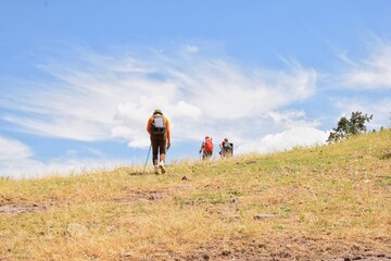 young woman walking in the mountains