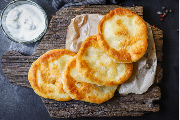 wrap flat bread tortillas from flour and water dough homemade cooking Takeaway handmade langos food background top view copy space