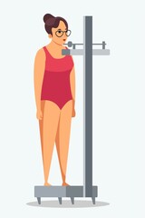 Woman in swimsuit stands on medical scales, person isolated