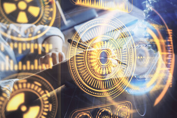 Fototapeta premium Tech theme hologram over woman's hands taking notes background. Concept of hightech. Double exposure