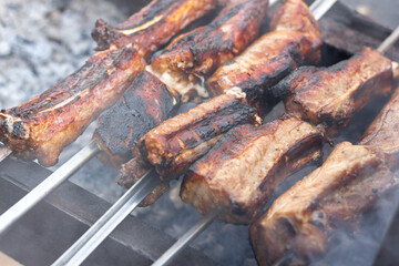 Marinated pork ribs skewers grilled in a barbecue