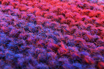 Abstract background red and blue wool with selective focus