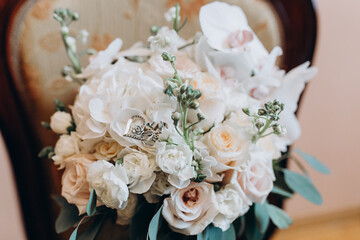 Beautiful wedding bouquet. Delicate petals of white and red roses.
