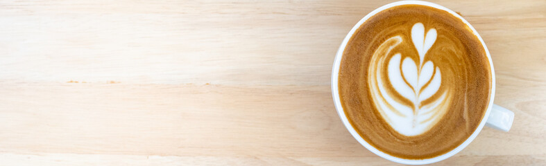Food and drink of hot coffee latte on wooden table using as background cover page coffee day