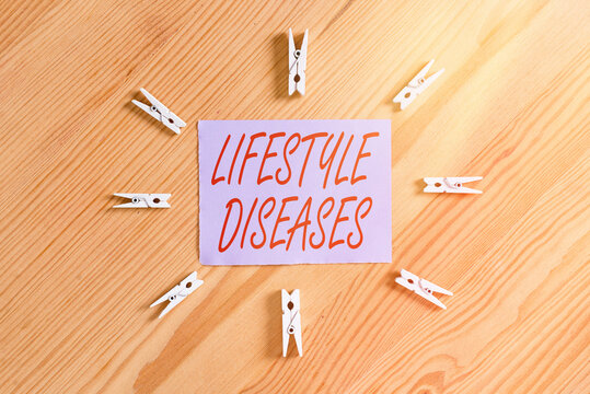 Handwriting text Lifestyle Diseases. Conceptual photo a disease associated with the way an individual lives Colored clothespin papers empty reminder wooden floor background office