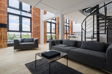 Living room in loft with big windows