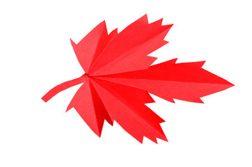 A red origami maple leaf in fall