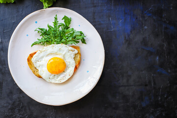 fried egg and toast bread salad delicious breakfast snack yolk and protein portion serving food background top view copy space eating healthy raw Takeaway