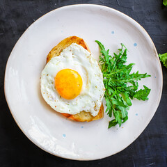 fried egg and toast bread salad delicious breakfast snack yolk and protein portion serving food background top view copy space eating healthy raw Takeaway