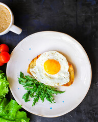 fried egg and toast bread salad delicious breakfast snack yolk and protein portion serving food background top view copy space eating healthy raw Takeaway