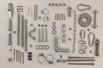 Fototapeta premium A flat lay of assorted hardware and fasteners