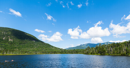 Fototapeta na wymiar Beautiful blue skies and lake view of Lonesome Lake in the White Mountains of New Hampshire