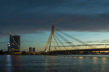 Cable stayed bridge across Daugava river at night in Riga, Latvia.
