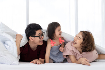 Mother, Father and disable kid in family.