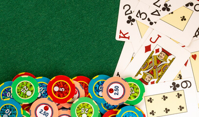 Deck cards on casino table with betting chips