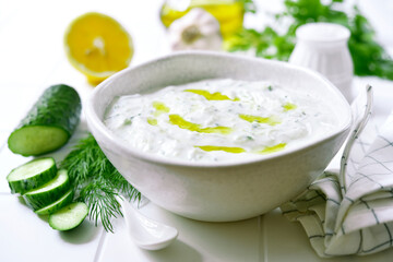 Obraz na płótnie Canvas Tzatziki - traditional greek yogurt sauce with cucumber, garlic and dill.
