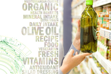 Female hand choosing organic virgin olive oil . Concept of healthy food, bio, vegetarian, diet.