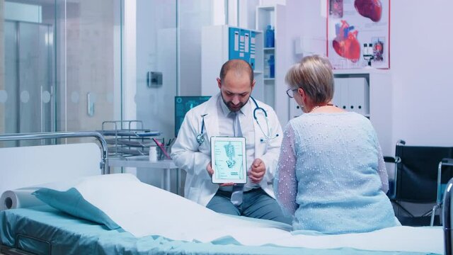 Experienced doctor explaining marble bone disease to senior elder woman patient sitting on hospital bed in private clinic. Medical services medicine healthcare well-being support, physician working