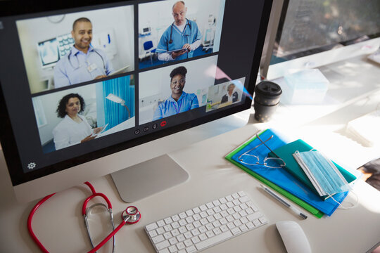 Doctors And Nurse Video Conferencing On Computer Screen