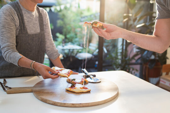 Couple enjoying fresh homemade pizza