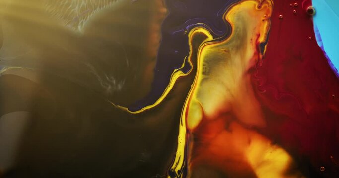 Abstract colors dissolving in water creating psychedelic effect. Liquid color macro concept. 