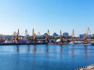 Odessa, Ukraine - August 15, 2016: Container cranes in cargo port terminal, cargo cranes without job in an empty harbor port. 
