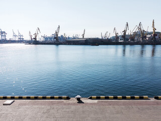 Odessa, Ukraine - August 15, 2016: Container cranes in cargo port terminal, cargo cranes without...