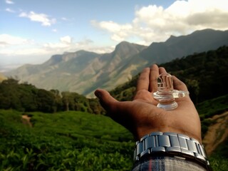 Bokeh shot of the transparent Shivalingam of lord Shiva with selective focus and mountains...