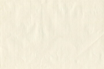 Grunge texture of old paper is yellowish, not very smooth. Abstract monochrome background of yellowish paper. Paper for letters.