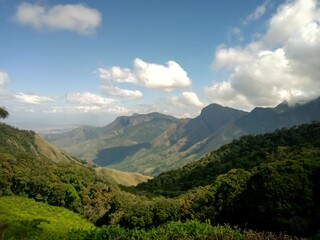 Beautiful landscape of tea plantation in the Indian state of Kerala with selective focus. landscape of the city, Munnar with its tea planatation, valley and Nilgiri mountain ranges.