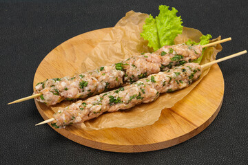 Raw minced pork skewer kebab for grill