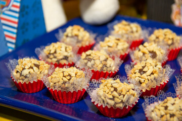 Peanut brigadeiro on the decorated birthday table, traditional Brazilian party candy