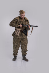 Male actor in the uniform of an officer of the army reconnaissance group of the Soviet Army during...