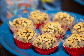 Peanut brigadeiro on the decorated birthday table, traditional Brazilian party candy