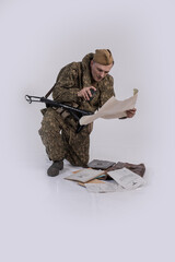 A male actor in the historical uniform of an officer of an army reconnaissance group of the Soviet...
