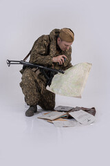 A male actor in the historical uniform of an officer of an army reconnaissance group of the Soviet...